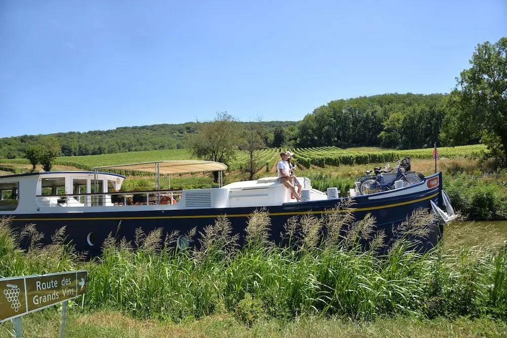 Aussie travellers are swapping city-hopping for slow barge cruises through Burgundy