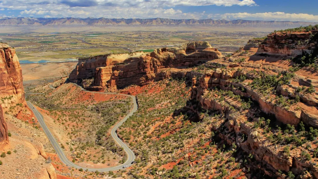 Colorado National Monument: The 23-Mile Drive Where Red Rock Towers Loom Right Beside the Road