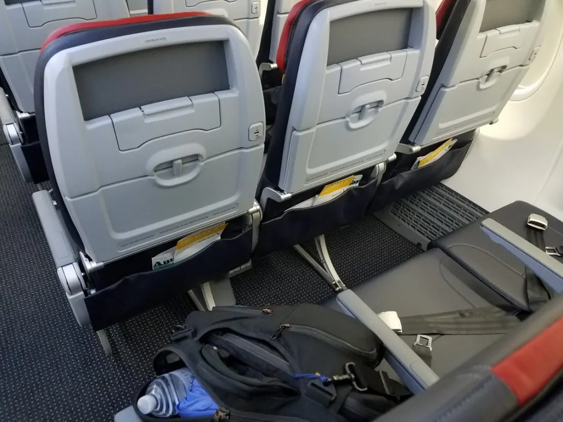 Paid for an Upgrade, Lost Half the Seat: What American Airlines' Extra-Seat Rules Actually Say