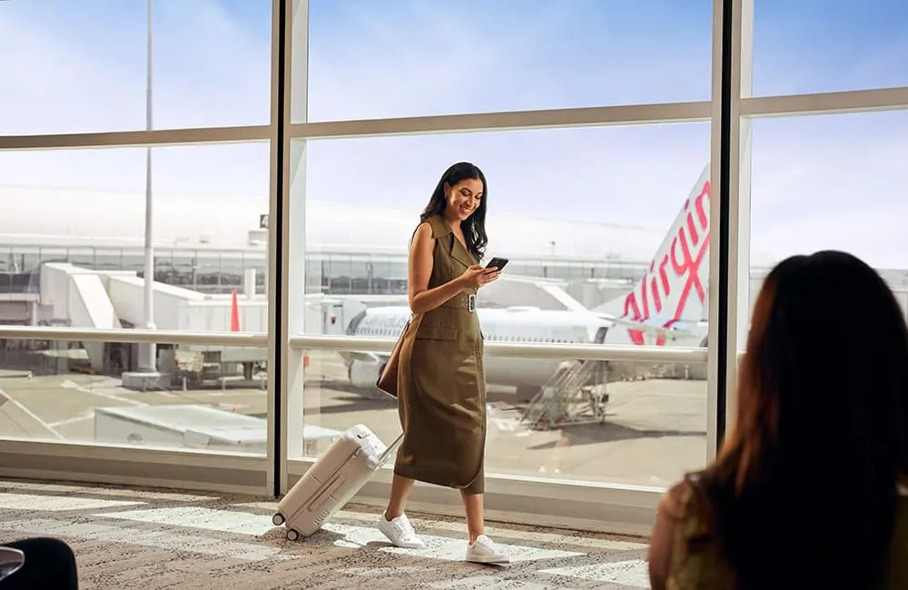 Velocity dangles 100 Status Credits and 100,000 points via credit cards — but flying still counts