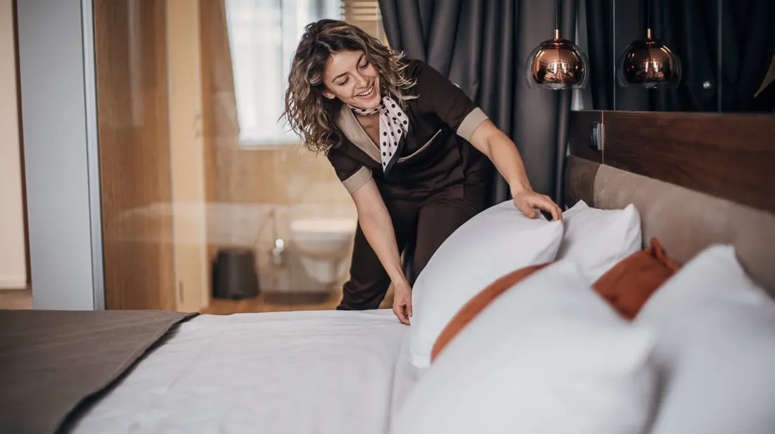 Why Hotel Beds Come Piled With Pillows (And How to Actually Use Them)