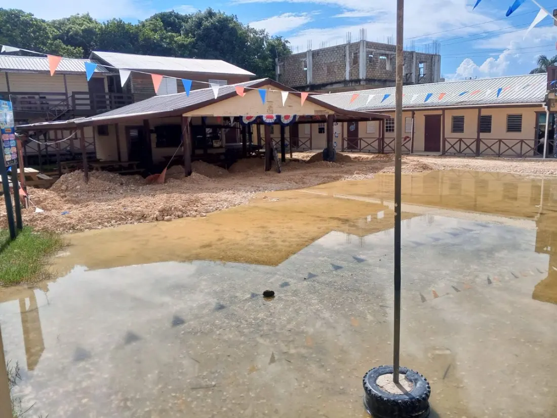 Heavy Rain Floods San Pedro Streets and a School, Highlighting the Island's Drainage Struggles